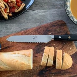 Alpha-Royal Japanese Serie 5,5" Allzweckmesser Wellen Damast-Stahl -Outdoor Grills Verkaufsgeschäft 10038997 de 0003 logo