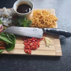 Executive-Plus Serie 7" Santokumesser 61 HRC Damaszenerstahl -Outdoor Grills Verkaufsgeschäft 10039011 de 0004 logo